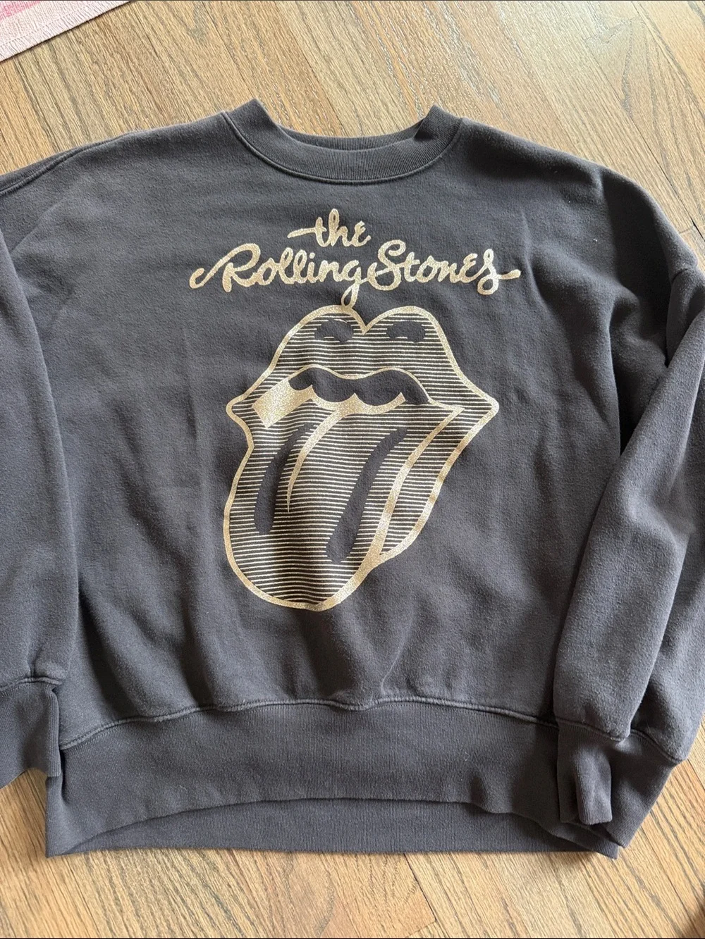 the Rolling Stones Black Sweatshirt with Gold Tongue Graphic